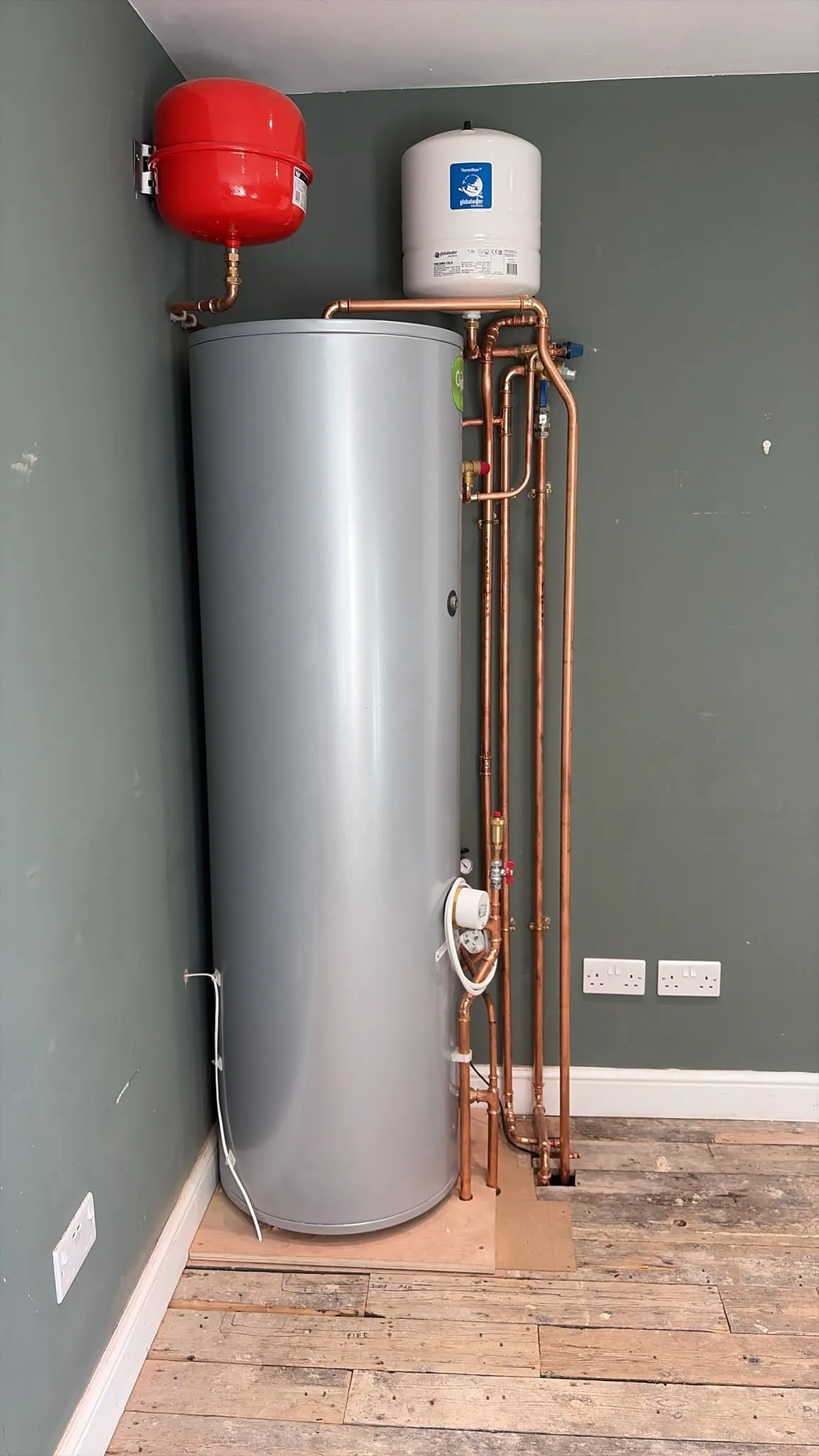 The finished Joule Cyclone unvented cylinder installation in Rickmansworth, with new copper pipework, on a raised base