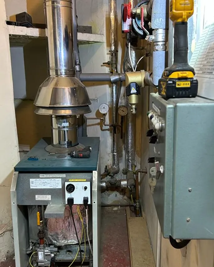 The Royal Thai Embassy's original floor standing gas boiler and flue before the Viessmann installation