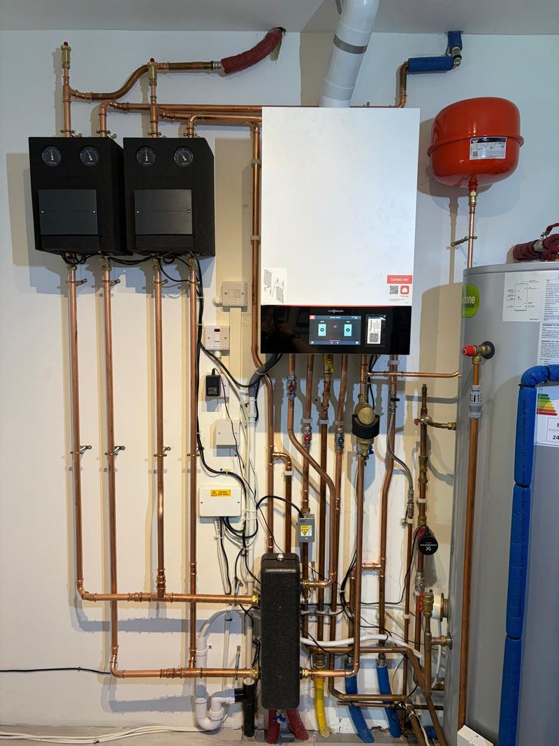 Viessmann 200-w System - Weather compensated, hot water priority, 2 Viessmann divicons heating circuits with mixers. Install Watford